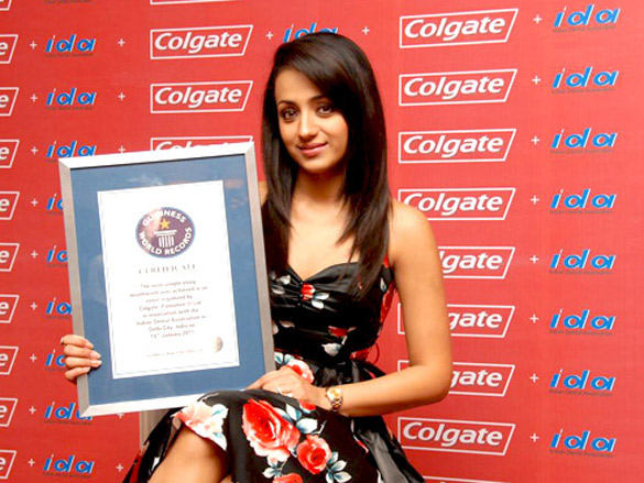 trisha poses with guinness world records certificate for colgate and ida 6