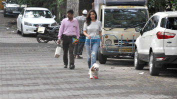 Sophie Choudry snapped taking her dog out for a walk