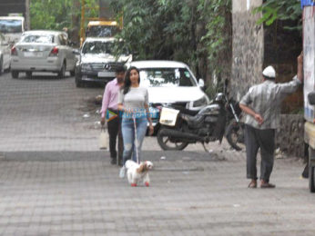 Sophie Choudry snapped taking her dog out for a walk