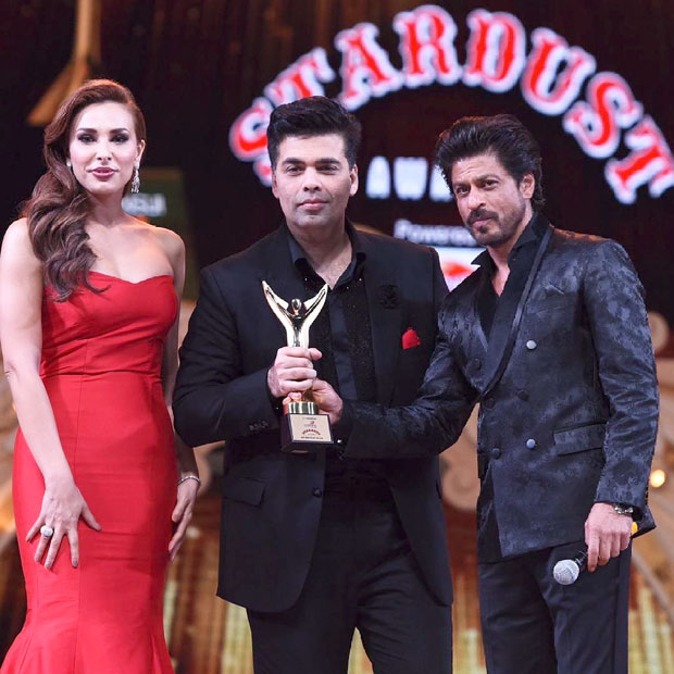 Iulia Vantur and Shah Rukh Khan together present the award to Karan Johar