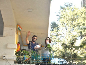 Saif Ali Khan and Kareena Kapoor Khan pose with baby Taimur outside their residence