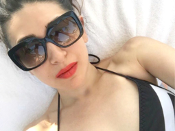 HOT: Karisma Kapoor beats the heat in a hot monochrome swimsuit