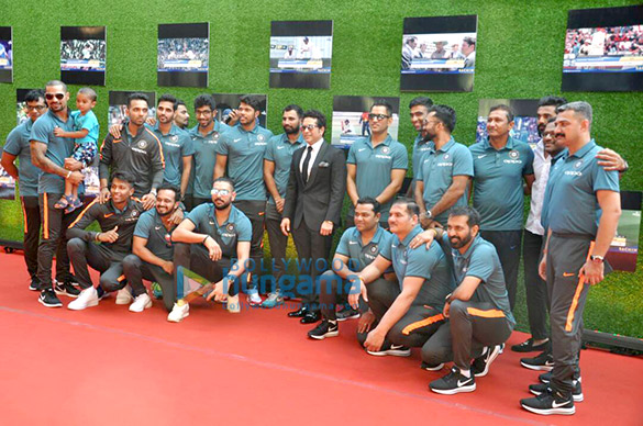 anushka sharma and cricketer virat kohli pose with sachin tendulkar at the premiere of sachin a billion dreams 1