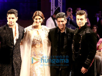 Sidharth Malhotra, Kriti Sanon and Karan Johar walk the ramp for Manish Malhotra's Design One show in Dubai