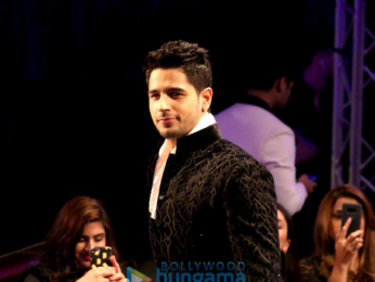 Sidharth Malhotra, Kriti Sanon and Karan Johar walk the ramp for Manish Malhotra's Design One show in Dubai