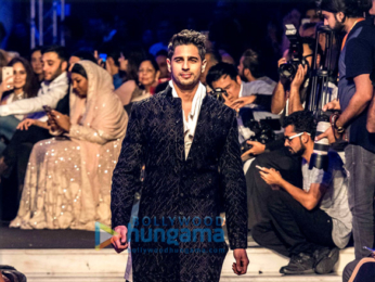 Sidharth Malhotra, Kriti Sanon and Karan Johar walk the ramp for Manish Malhotra's Design One show in Dubai