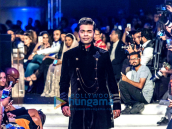 Sidharth Malhotra, Kriti Sanon and Karan Johar walk the ramp for Manish Malhotra's Design One show in Dubai