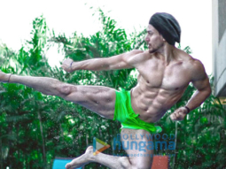 WHOA! Tiger Shroff shows off his ripped body while doing a flying kick in a swimming pool for Baaghi 2