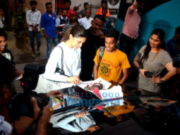 Deepika Padukone cuts a cake for a fan