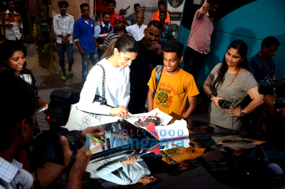 Deepika Padukone cuts a cake for a fan Deepika Padukone cuts a cake for a fan