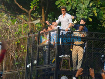 Shah Rukh Khan waves to fans from Mannat on his 52nd birthday