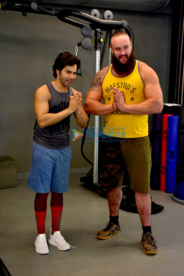 Varun Dhawan flexes his muscles with WWE Superstar Braun Strowman