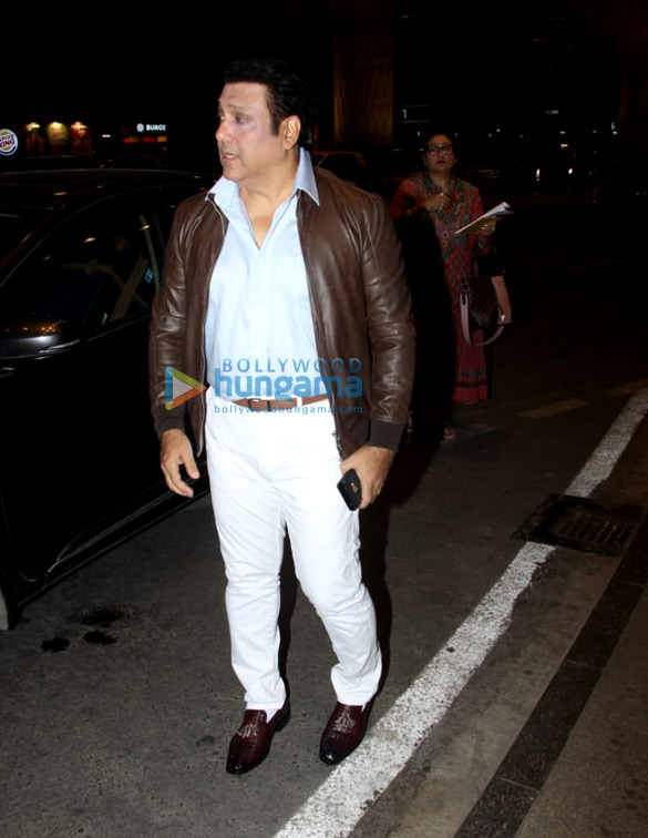 govinda snapped with his wife at the airport 6