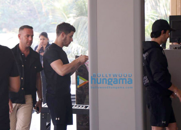 joe jonas and nick jonas arrive at a mumbai hotel 2