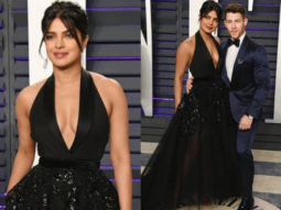 Wowza! Priyanka Chopra says a sassy Namaste in a black Elie Saab gown at the Vanity Fair Oscar 2019 party!