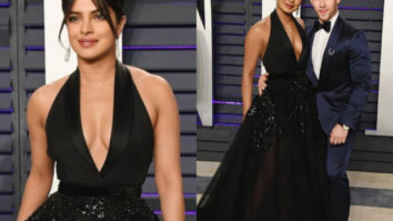 Wowza! Priyanka Chopra says a sassy Namaste in a black Elie Saab gown at the Vanity Fair Oscar 2019 party!