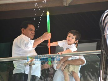 Taimur Ali Khan spotted playing Holi in his balcony