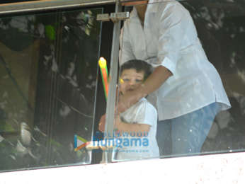 Taimur Ali Khan spotted playing Holi in his balcony