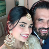 Athiya Shetty and Suneil Shetty are all smiles as they pose for a selfie at a wedding