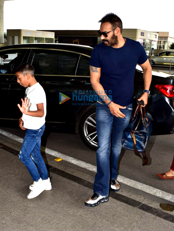 sonam kapoor ahuja anand ahuja and karan johar snapped at the airport 1 2