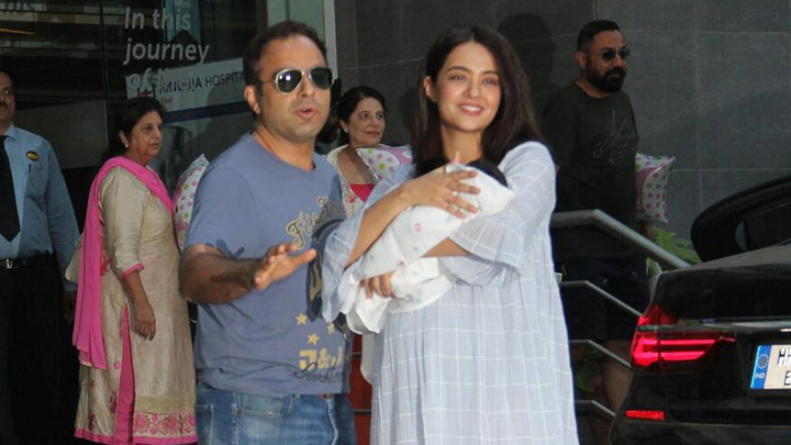 Surveen Chawla snapped with her new born baby after her discharge from hospital