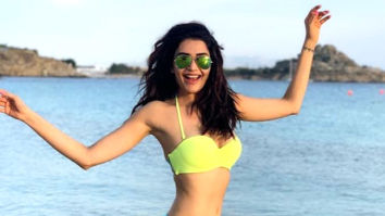 Karishma Tanna gets her beach mode on and rocks in a fluorescent bikini