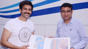 Kartik Aaryan is all smiles as he receives a customised stamp collection from Lucknow GPO!