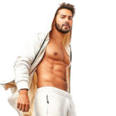 Varun Dhawan working out SHIRTLESS in just his orange trunks is going to make the melancholic weather better for you