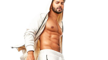 Varun Dhawan working out SHIRTLESS in just his orange trunks is going to make the melancholic weather better for you