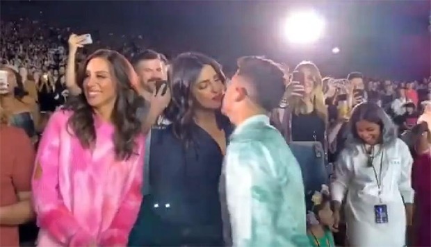 WATCH VIDEO: Nick Jonas kisses Priyanka Chopra during his Happiness Begins Tour 