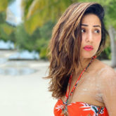 Hina Khan flaunts her perfect body in an orange BIKINI by the beach in Maldives
