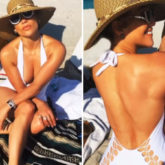 Jennifer Lopez soaks under the Miami sun flaunting her toned body in white halter-neck swimsuit