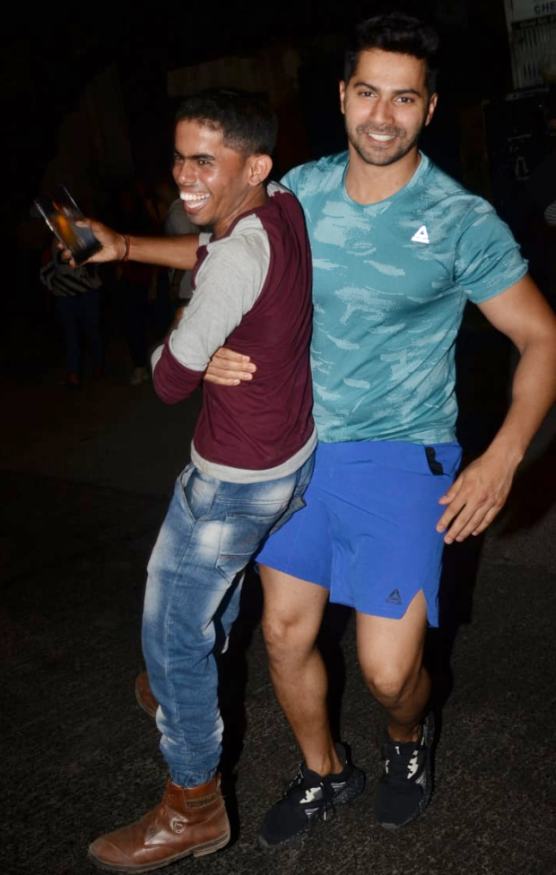 Varun Dhawan surprises a paparazzi as he lifts him his arms in this viral video Varun Dhawan surprises a paparazzi as he lifts him his arms in this viral video