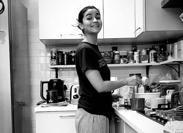 Alia Bhatt grins as she gets clicked while making a pudding