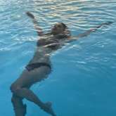 Mouni Roy sizzles in black bikini as she goes swimming