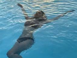 Mouni Roy sizzles in black bikini as she goes swimming