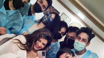 Jacqueline Fernandez poses with her team as she resumes work