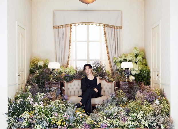 BTS drops second interactive concept photos that feature member Jimin surrounded by a room full of flowers