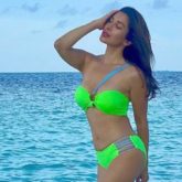 Sophie Choudry complements the blue sea as she poses in a neon green bikini worth Rs 6.3k