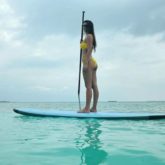 Disha Patani goes surfing, recreates the iconic Aquaman pose in a neon bikini
