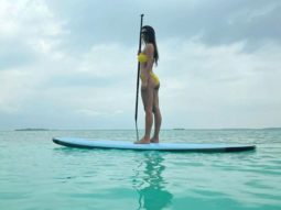 Disha Patani goes paddle boarding, recreates the iconic Aquaman pose in a neon bikini