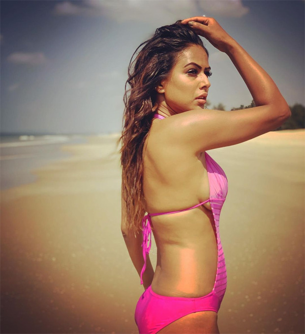 Nia Sharma looks smoking hot in a pink monokini as she soaks in ‘vitamin sea’