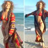 Jennifer Lopez flaunts her toned body as she raises the temperature in a red bikini