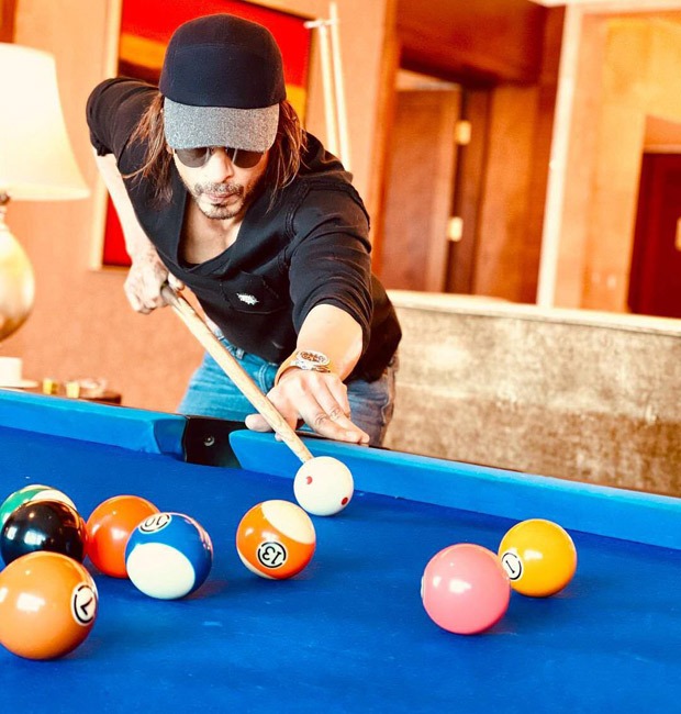 Shah Rukh Khan gives a glimpse of his Pathan look for the first time while playing a game of pool Shah Rukh Khan gives a glimpse of his Pathan look for the first time while playing a game of pool