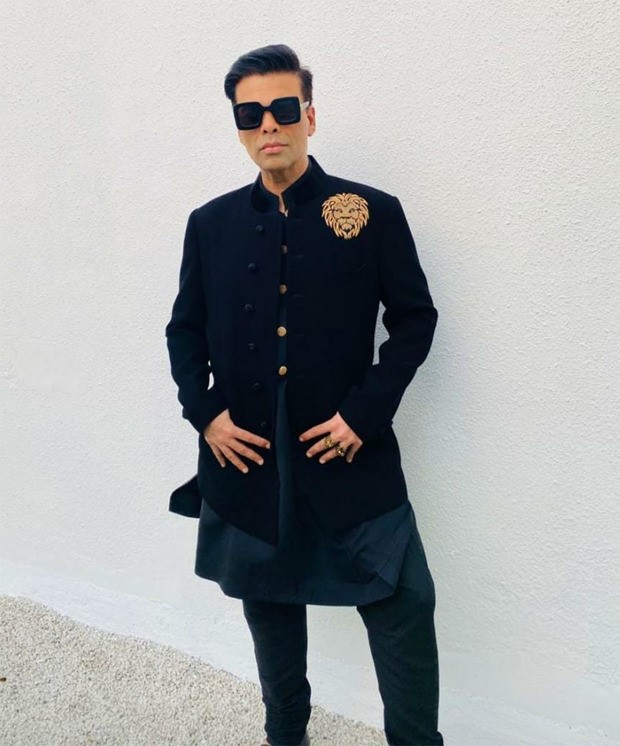 Varun Dhawan - Natasha Dalal Wedding: Karan Johar keeps it dapper in Manish Malhotra attire