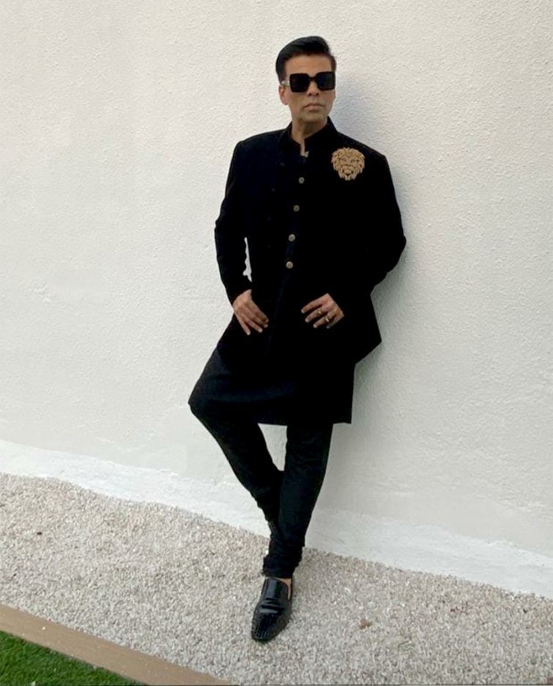 Varun Dhawan - Natasha Dalal Wedding: Karan Johar keeps it dapper in Manish Malhotra attire