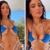 Kylie Jenner flaunts her curves in barely-there skimpy navy blue bikini.