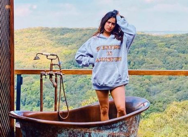Janhvi Kapoor looks annoyed as she poses in a rusted bathtub