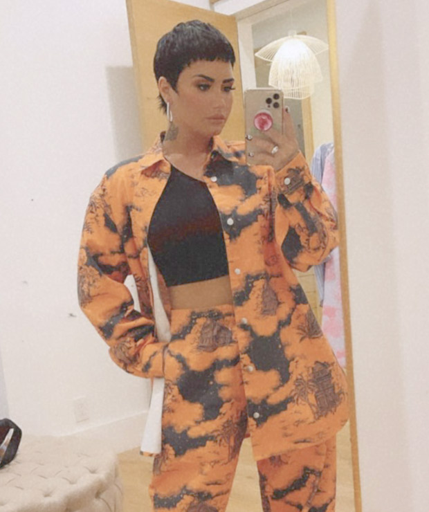 Demi Lovator sets summer vibe in her printed orange co-ords with Balenciaga boots worth Rs. 82,000