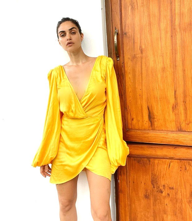 Gabriella Demetriades is a ray of sunshine in plunging neckline yellow mini wrap dress Gabriella Demetriades is a ray of sunshine in plunging neckline yellow mini wrap dress